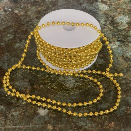 Gold Pearls on a Reel