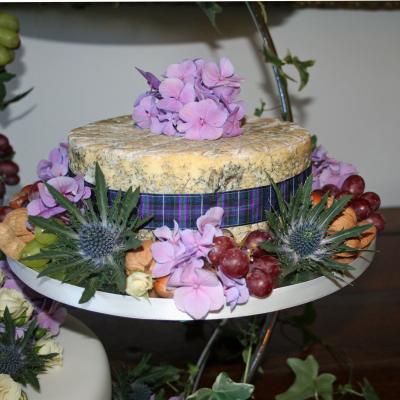 Wedding cheese decorated with fresh fruits and flowers