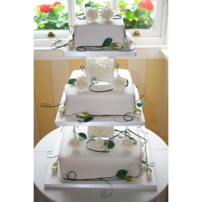 Cake with Glass Separators and White Sugar Roses