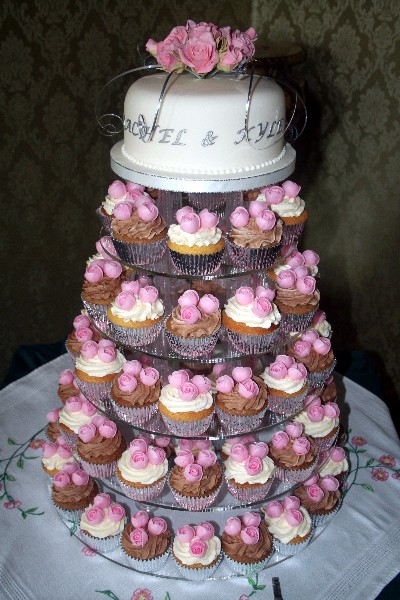 Pink Wafer Roses Wedding Cake with sugarcraft bouquet top tier.
