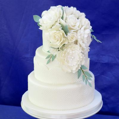 Waterfall cascade of hand-crafted sugar flowers.