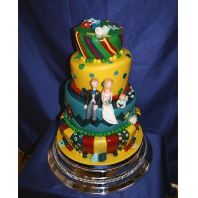 Colourful Topsy Turvy Wedding Cake with Bride, Groom and Baby